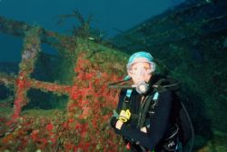 Pam on the Bibb wreck (laying on her side) 125' Nikonos 1... by Michael Salcito 